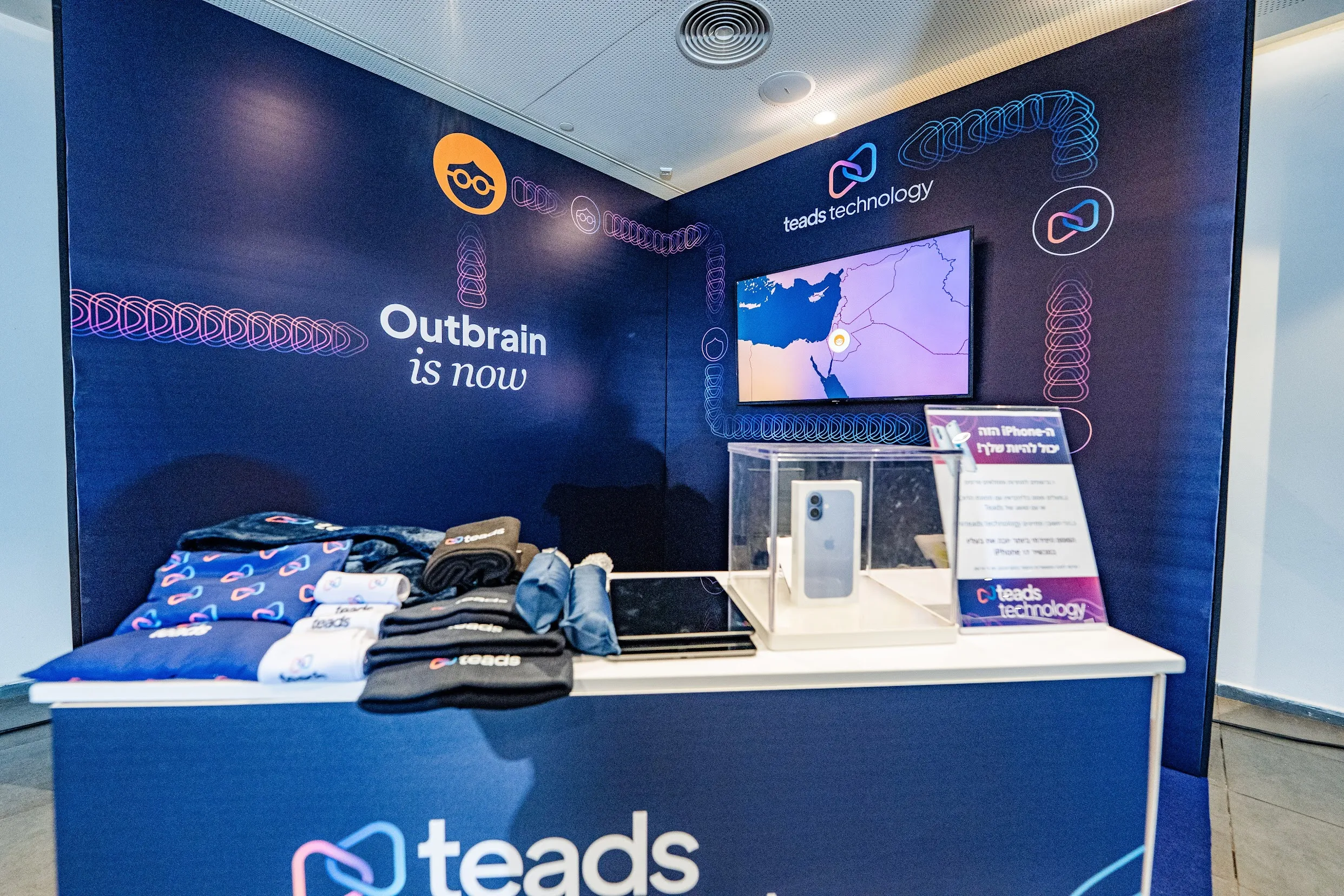 A sponsor booth with branded merchandise and product display