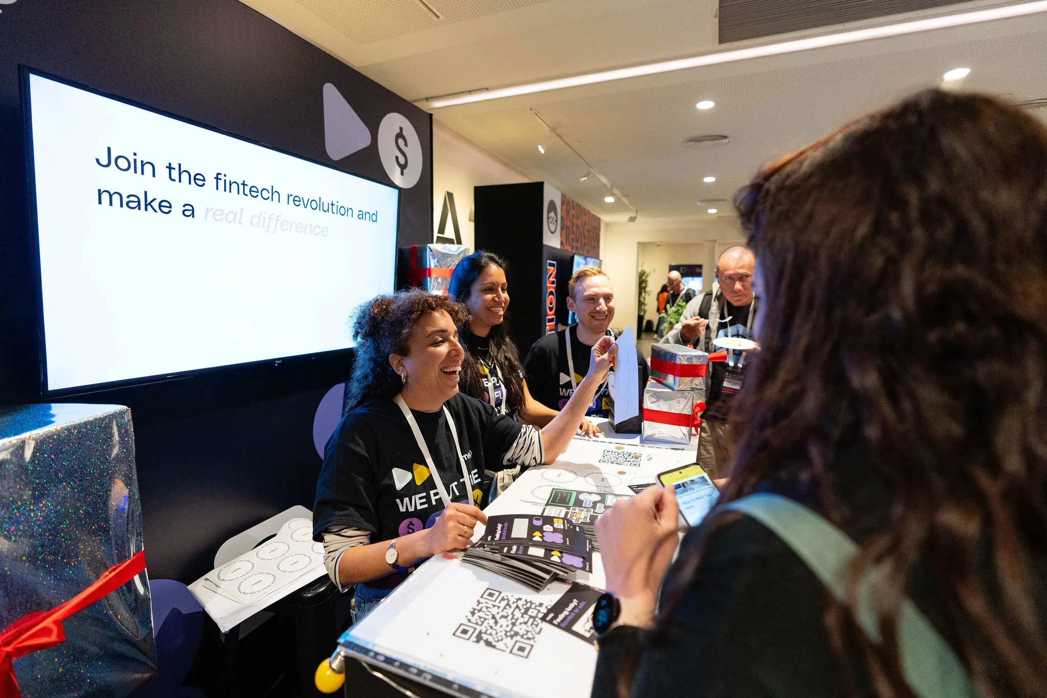 Sponsor team engaging attendees at their booth